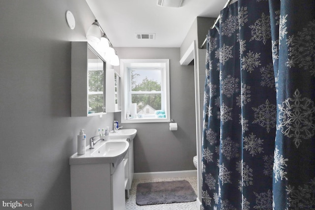 104 Ferndale Rd, Glen Burnie, MD 21061 - bathroom with double vanity and baseboards