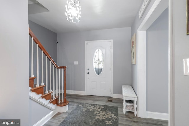 104 Ferndale Rd, Glen Burnie, MD 21061 - foyer entrance with stairway, wood finished floors, and a chandelier