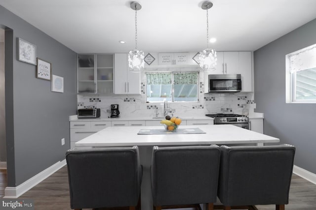 104 Ferndale Rd, Glen Burnie, MD 21061 - kitchen featuring stainless steel appliances, a chandelier, backsplash, light countertops, and recessed lighting