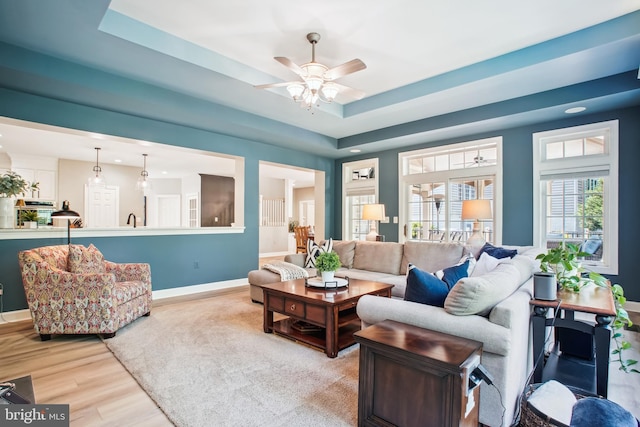 18510 Barton Creek Pl, Leesburg, VA 20176 - living room featuring wood finished floors, a ceiling fan, recessed lighting, and a raised ceiling