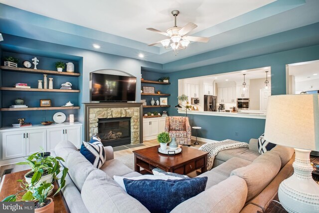 18510 Barton Creek Pl, Leesburg, VA 20176 - living area featuring a ceiling fan, a fireplace, recessed lighting, and light wood finished floors