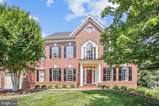 18510 Barton Creek Pl, Leesburg, VA 20176 - georgian-style home with brick siding and a front yard