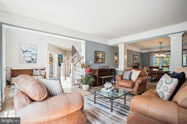 18510 Barton Creek Pl, Leesburg, VA 20176 - living area featuring ornate columns, crown molding, wood finished floors, a chandelier, and stairway