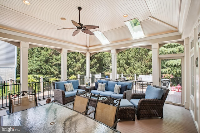 18510 Barton Creek Pl, Leesburg, VA 20176 - sunroom / solarium with expansive windows, wood ceiling, a skylight, a deck, and crown molding