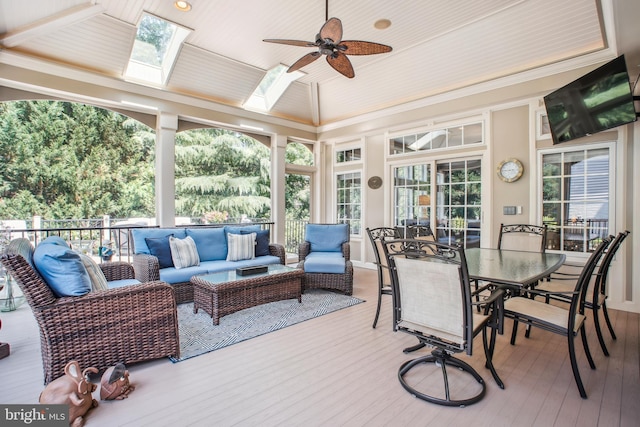 18510 Barton Creek Pl, Leesburg, VA 20176 - sunroom / solarium with a wooden deck, wood finished floors, plenty of natural light, a skylight, and ornamental molding