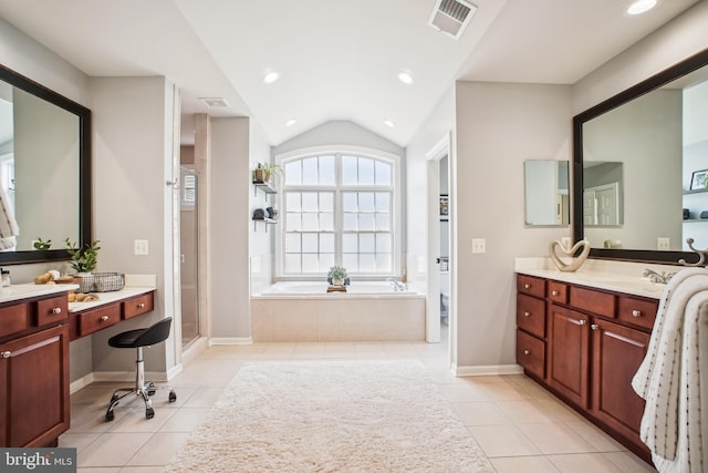 18510 Barton Creek Pl, Leesburg, VA 20176 - bathroom with a garden tub, tile patterned flooring, vanity, lofted ceiling, and recessed lighting