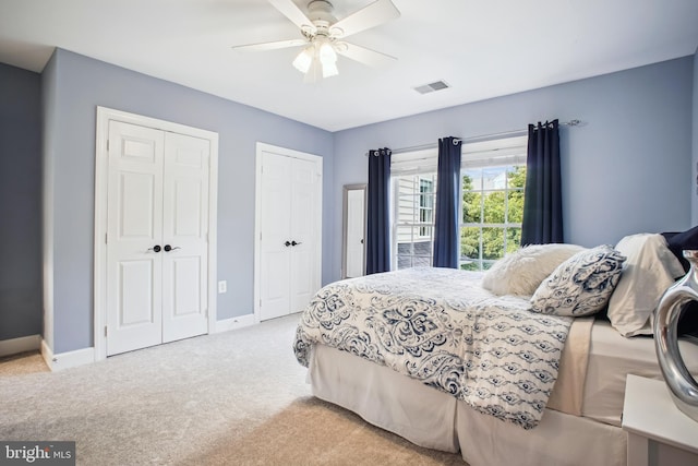 18510 Barton Creek Pl, Leesburg, VA 20176 - bedroom with carpet floors, two closets, and ceiling fan