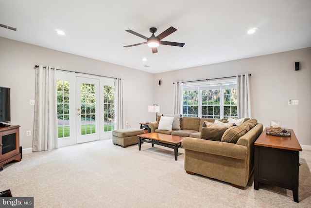 18510 Barton Creek Pl, Leesburg, VA 20176 - living room with light colored carpet, a ceiling fan, plenty of natural light, recessed lighting, and french doors