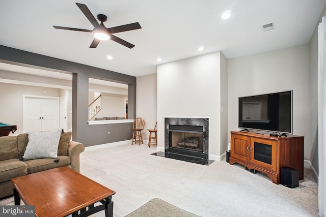 18510 Barton Creek Pl, Leesburg, VA 20176 - carpeted living area with ceiling fan, stairway, recessed lighting, and a premium fireplace