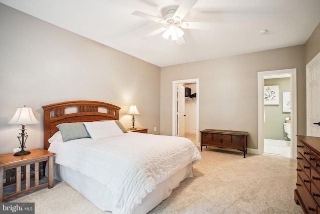 18510 Barton Creek Pl, Leesburg, VA 20176 - bedroom with light colored carpet, a spacious closet, a closet, a ceiling fan, and ensuite bath