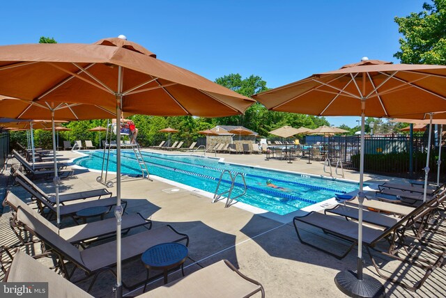 18510 Barton Creek Pl, Leesburg, VA 20176 - community pool with a patio