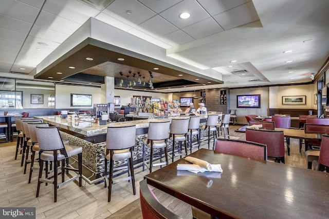 18510 Barton Creek Pl, Leesburg, VA 20176 - dining space with light wood-style flooring, a tray ceiling, and recessed lighting