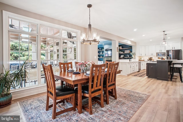 18510 Barton Creek Pl, Leesburg, VA 20176 - dining room featuring healthy amount of natural light, light wood-type flooring, a chandelier, and recessed lighting