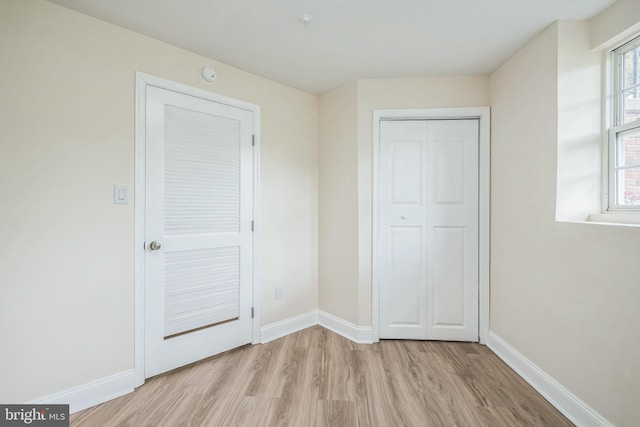 5514 Aeriel Pl, Frederick, MD 21703 - unfurnished bedroom with light wood-style flooring, multiple windows, and a closet