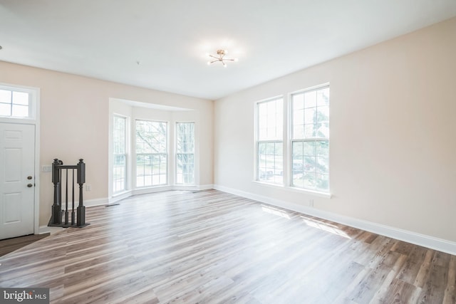 5514 Aeriel Pl, Frederick, MD 21703 - unfurnished living room with plenty of natural light and wood finished floors