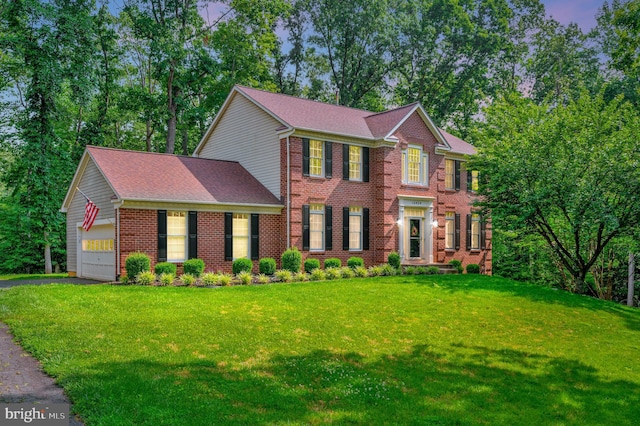 12424 Silent Wolf Dr, Manassas, VA 20112 - view of front of property featuring driveway, a front lawn, an attached garage, and brick siding