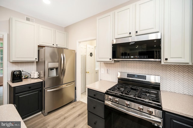 12424 Silent Wolf Dr, Manassas, VA 20112 - kitchen featuring appliances with stainless steel finishes, backsplash, and white cabinets