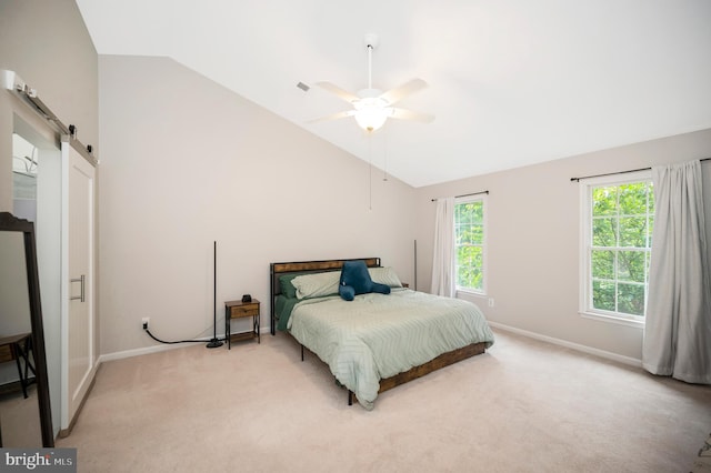 12424 Silent Wolf Dr, Manassas, VA 20112 - bedroom featuring lofted ceiling, light colored carpet, a barn door, and a ceiling fan