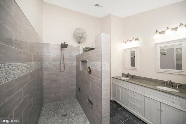 12424 Silent Wolf Dr, Manassas, VA 20112 - bathroom featuring double vanity, a walk in shower, and tile patterned flooring