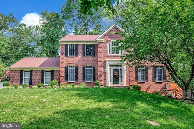 12424 Silent Wolf Dr, Manassas, VA 20112 - colonial home with a front lawn and brick siding
