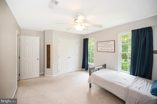 12424 Silent Wolf Dr, Manassas, VA 20112 - bedroom with light carpet, a closet, and ceiling fan