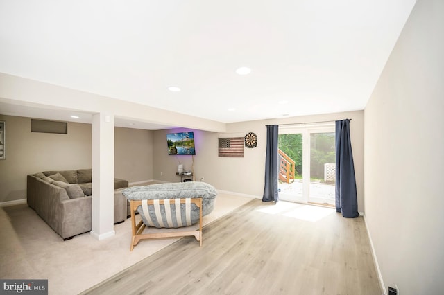 12424 Silent Wolf Dr, Manassas, VA 20112 - living area with light wood-type flooring and recessed lighting