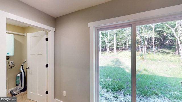 542 Hidden Acres Rd, Mount Storm, WV 26739 - doorway to outside featuring light tile patterned floors and tankless water heater