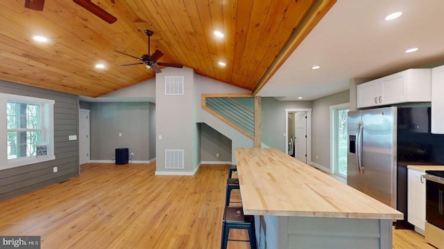 542 Hidden Acres Rd, Mount Storm, WV 26739 - kitchen featuring wooden counters, ceiling fan, white cabinetry, light wood finished floors, and vaulted ceiling