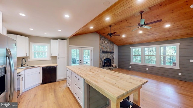542 Hidden Acres Rd, Mount Storm, WV 26739 - kitchen with appliances with stainless steel finishes, french doors, light wood-style floors, a ceiling fan, and white cabinets