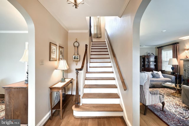 3172 N George St, Emigsville, PA 17318 - stairs with arched walkways, ornamental molding, hardwood / wood-style flooring, and baseboards