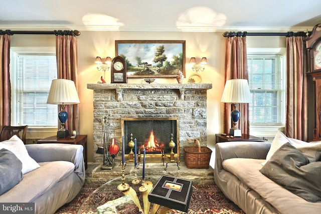 3172 N George St, Emigsville, PA 17318 - living area featuring crown molding, a stone fireplace, and plenty of natural light