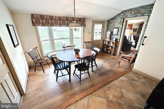 3172 N George St, Emigsville, PA 17318 - dining room featuring lofted ceiling, a chandelier, tile patterned flooring, and baseboards