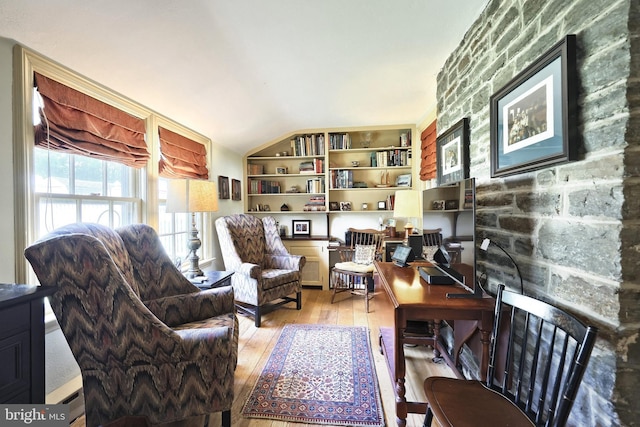 3172 N George St, Emigsville, PA 17318 - living area with hardwood / wood-style floors, built in shelves, and vaulted ceiling