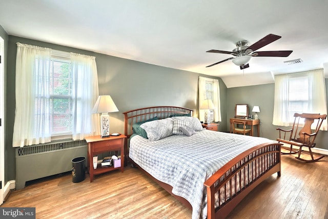 3172 N George St, Emigsville, PA 17318 - bedroom with wood finished floors, ceiling fan, baseboards, and radiator heating unit