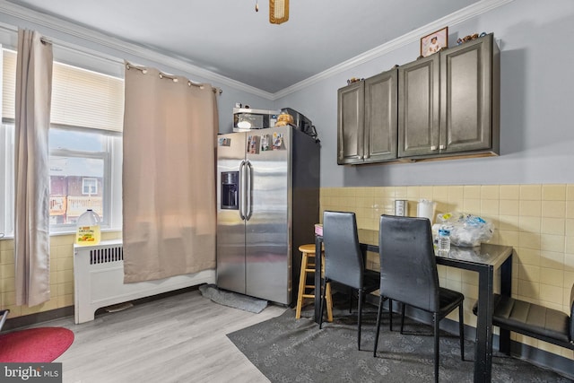 3537 Chippendale Ave, Philadelphia, PA 19136 - kitchen featuring stainless steel refrigerator with ice dispenser, crown molding, light wood finished floors, a ceiling fan, and tile walls