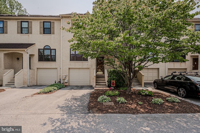3305 Keswick Way Unit 3305D, West Chester, PA 19382 - townhome / multi-family property featuring stairs, driveway, stucco siding, and a garage