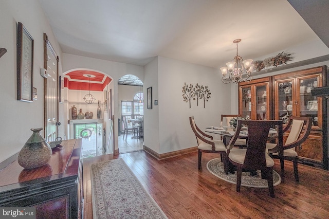 3305 Keswick Way Unit 3305D, West Chester, PA 19382 - dining space featuring arched walkways, wood finished floors, and a chandelier