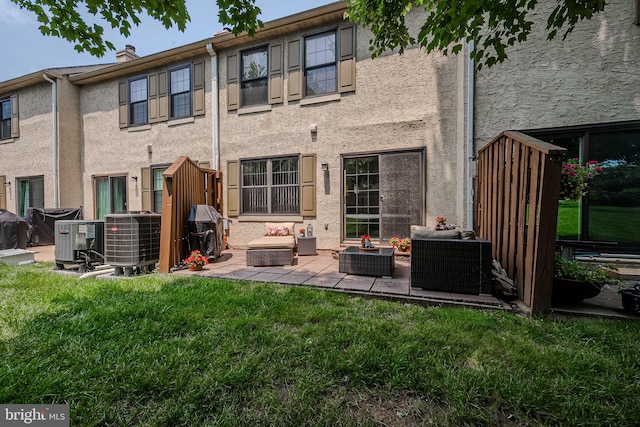 3305 Keswick Way Unit 3305D, West Chester, PA 19382 - back of property with outdoor lounge area, stucco siding, a yard, and a patio