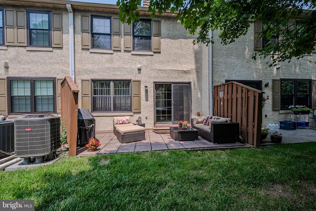 3305 Keswick Way Unit 3305D, West Chester, PA 19382 - back of house featuring outdoor lounge area, a patio, stucco siding, and a lawn