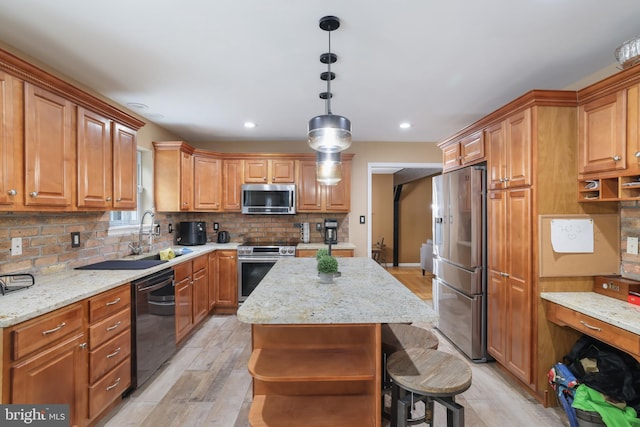 2299 Long Acre Dr, Effort, PA 18330 - kitchen with appliances with stainless steel finishes, decorative backsplash, light wood-type flooring, a center island, and light stone countertops