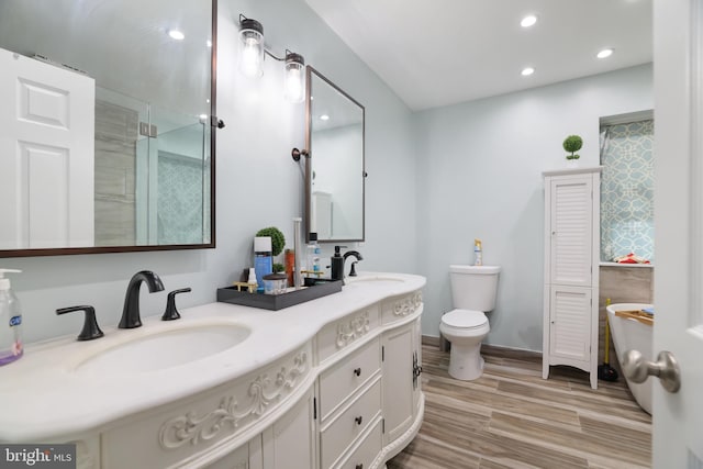 2299 Long Acre Dr, Effort, PA 18330 - bathroom featuring double vanity, recessed lighting, wood finished floors, and an enclosed shower