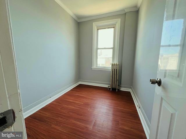 1609 S 28th St, Philadelphia, PA 19145 - empty room featuring radiator heating unit, crown molding, and dark wood-style floors