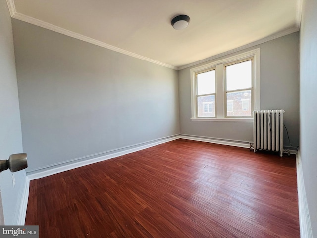 1609 S 28th St, Philadelphia, PA 19145 - empty room with radiator, dark wood-style flooring, and ornamental molding
