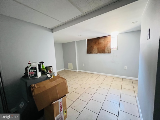 1609 S 28th St, Philadelphia, PA 19145 - finished basement featuring light tile patterned floors and baseboards