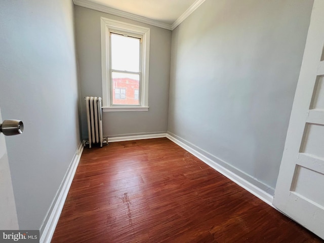 1609 S 28th St, Philadelphia, PA 19145 - unfurnished room featuring radiator heating unit, crown molding, and dark wood-type flooring