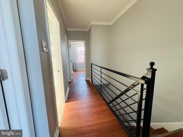 1609 S 28th St, Philadelphia, PA 19145 - hall featuring an upstairs landing, radiator heating unit, crown molding, and wood finished floors
