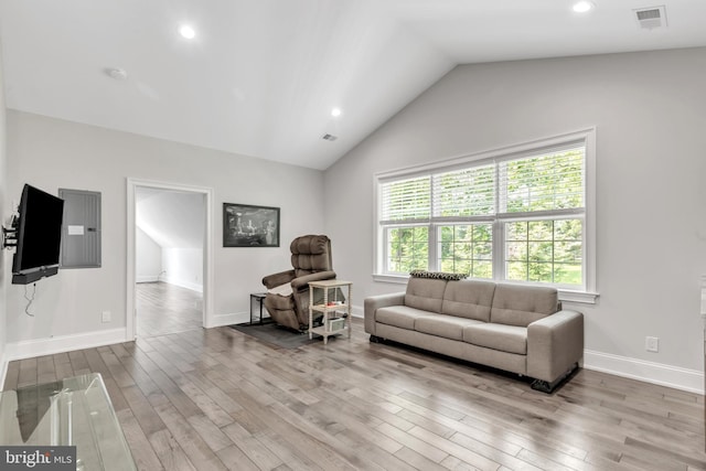 1631 E Strasburg Rd, West Chester, PA 19380 - living area featuring wood finished floors, vaulted ceiling, electric panel, and recessed lighting