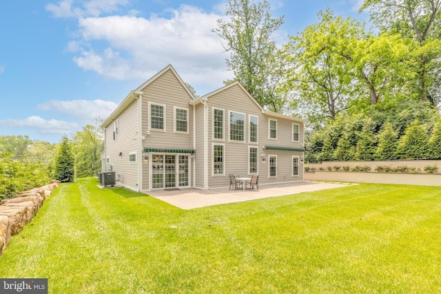 1631 E Strasburg Rd, West Chester, PA 19380 - back of property featuring a patio and a lawn