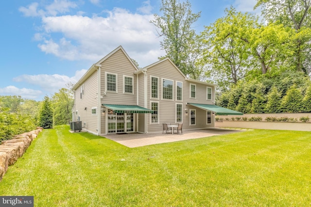 1631 E Strasburg Rd, West Chester, PA 19380 - back of property featuring a patio area and a lawn