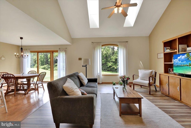 96 Gunhart Rd, Mohnton, PA 19540 - living room with high vaulted ceiling, a ceiling fan, a skylight, light wood-type flooring, and a chandelier